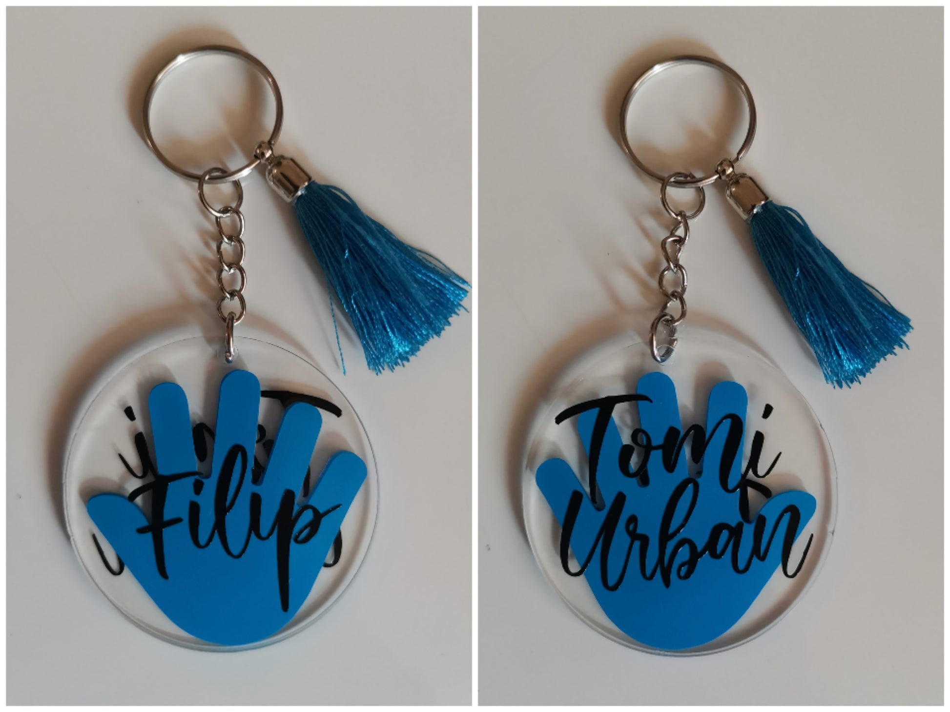 personaliziran obesek za ključe z motivom roke in napisom otroških imen