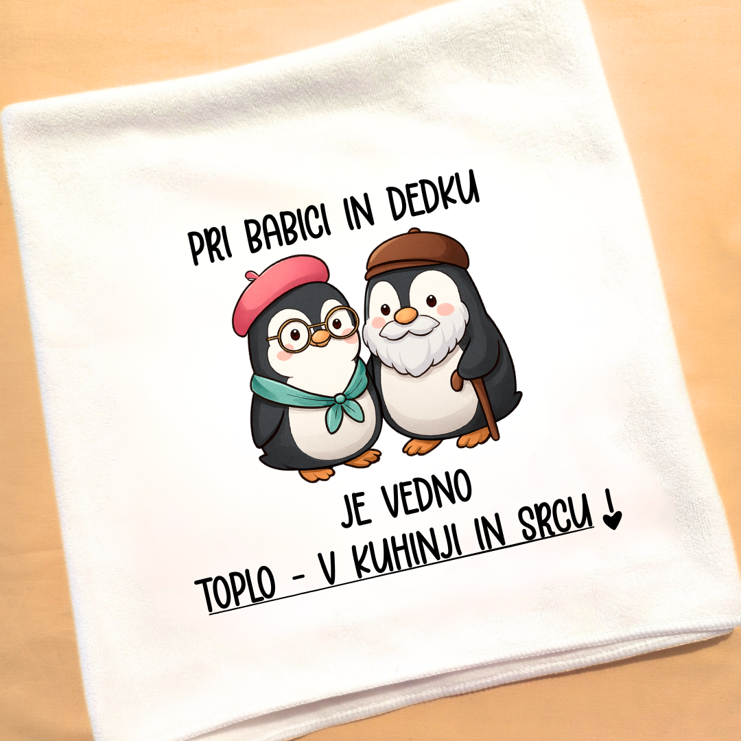 Kuhinjska brisača z motivom pingvinov in napisom Pri babici in dedku je vedno toplo – darilo za stare starše